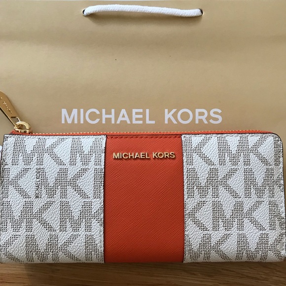 Michael Kors Handbags - Michael Kors three quarter zip wallet tangerine